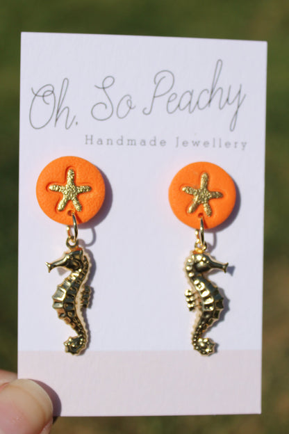 Polymer Clay Starfish Stud Earrings With A Gold Seahorse Charm Orange